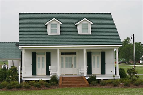 white house with green metal roof|white house with galvalume roof.